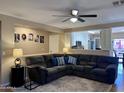 Spacious living room featuring comfortable seating, a ceiling fan, and stylish decor at 6049 S Wilson Dr, Chandler, AZ 85249
