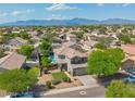 Beautiful two-story home featuring a well-manicured lawn and inviting curb appeal in a lush neighborhood at 6321 W Gross Ave, Phoenix, AZ 85043