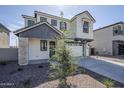 Charming two-story home with a two car garage, desert landscape, and neutral stucco at 644 N Vine St, Chandler, AZ 85225