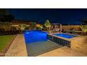 Stunning pool and spa with elegant tile work, perfect for evening relaxation at 10207 W Hedge Hog Pl, Peoria, AZ 85383