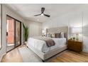 Comfortable main bedroom showcasing stylish decor, natural light, and patio access at 12222 N Paradise Village S Pkwy # 237, Phoenix, AZ 85032