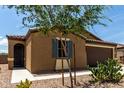 Single-story home featuring low maintenance desert landscaping at 128 S 200Th Ave, Buckeye, AZ 85326