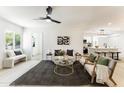 Inviting living room with contemporary decor, neutral tones, natural light, and seamless flow to kitchen at 1425 E Diamond St, Phoenix, AZ 85006