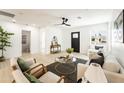 Cozy living room with a modern ceiling fan, neutral color palette, ample light, and great layout at 1425 E Diamond St, Phoenix, AZ 85006