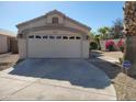 Inviting home featuring a spacious two-car garage and desert landscaping at 14602 S 47Th St, Phoenix, AZ 85044