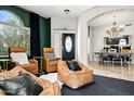 Relax and enjoy this living space featuring modern decor, comfortable seating, and a stunning chandelier at 14826 N 92Nd Pl, Scottsdale, AZ 85260