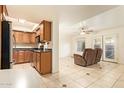 Spacious living area with tile flooring, kitchen view and cozy seating area at 151 E Broadway Rd # 103, Tempe, AZ 85282