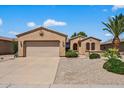 Charming single-story home featuring a two-car garage and low maintenance desert landscaping at 16412 W Peppertree Ct, Surprise, AZ 85387