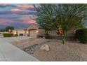 Landscaped front yard with a tree, rocks and desert accents at 1963 E Monterey St, Chandler, AZ 85225