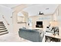 Bright living room with tile flooring, archways, and natural light at 215 W Mountain Sage Dr, Phoenix, AZ 85045