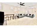 Open-concept living area with neutral tones and modern ceiling fan at 215 W Mountain Sage Dr, Phoenix, AZ 85045