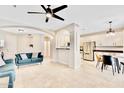 Inviting living space featuring an open floor plan with a view of the kitchen at 215 W Mountain Sage Dr, Phoenix, AZ 85045