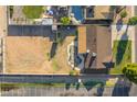 Aerial view showcasing the property's full backyard, pool, fire pit, and potential for a tennis court at 2261 E Decatur St, Mesa, AZ 85213