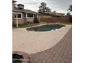 Enjoy a spacious backyard featuring a refreshing pool surrounded by a patio, ideal for summer relaxation and entertaining at 2419 W Crocus Dr, Phoenix, AZ 85023