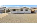 Charming single-story home with gravel front yard and covered carport for convenient parking at 3553 W El Camino Dr, Phoenix, AZ 85051