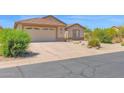 The property features low-maintenance desert landscaping and a spacious driveway leading to the garage at 4611 E Night Glow Dr, Cave Creek, AZ 85331