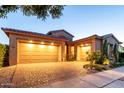 Beautiful home with a spacious three-car garage and a well-maintained brick driveway at 5328 S Wesley Cir, Mesa, AZ 85212