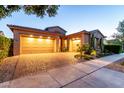 Beautiful home with a spacious three-car garage and a well-maintained brick driveway at 5328 S Wesley Cir, Mesa, AZ 85212