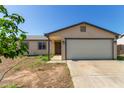 Charming single-story home featuring a neutral color palette, attached garage, and a low-maintenance front yard at 8051 W Mariposa Dr, Phoenix, AZ 85033