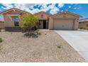 Charming single-story home with a well-maintained yard and spacious two-car garage at 15248 S 182Nd Ln, Goodyear, AZ 85338
