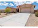 Charming single-story home with a well-maintained yard and spacious two-car garage at 15248 S 182Nd Ln, Goodyear, AZ 85338