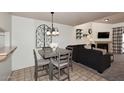 Cozy dining area adjacent to the living room, showcasing stylish furnishings and decor at 205 N 74Th St # 248, Mesa, AZ 85207