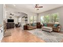 Spacious living room with fireplace, comfortable seating, and lots of natural light at 21353 S 185Th Way, Queen Creek, AZ 85142