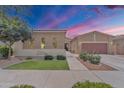 Charming single-story home with well-maintained landscaping and a two-car garage, inviting curb appeal at 22927 E Via Del Oro --, Queen Creek, AZ 85142