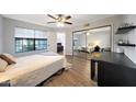 Inviting bedroom featuring wood floors, a mirrored closet, and a calming color palette at 2333 E Southern Ave # 1049, Tempe, AZ 85282