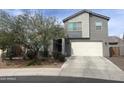 Two-story home featuring a two-car garage and low maintenance landscaping at 2364 N 212Th Ave, Buckeye, AZ 85396