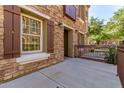 Charming exterior view of a stone clad two-story house with brown accents and well maintained landscaping at 2636 S Bahama Dr, Gilbert, AZ 85295