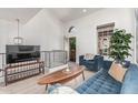 Cozy living area featuring modern decor, a comfortable blue sofa, and plenty of natural light at 2636 S Bahama Dr, Gilbert, AZ 85295