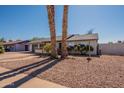 Attractive single-story home enhanced by mature trees, providing shade and curb appeal to this property at 3118 S Los Altos Dr, Mesa, AZ 85202