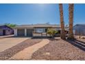 Inviting single-story home enhanced by mature trees, providing shade and curb appeal to this property at 3118 S Los Altos Dr, Mesa, AZ 85202