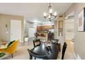 Open-concept living area leading to a kitchen with bar seating at 3330 S Gilbert Rd # 2090, Chandler, AZ 85286