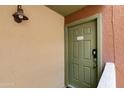 A close up of a unit front door showcasing the unit number, hardware and exterior light at 3500 N Hayden Rd # 2110, Scottsdale, AZ 85251