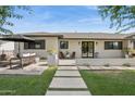 Beautiful home exterior with a cozy seating area and landscaped front yard at 4215 E Flower St, Phoenix, AZ 85018