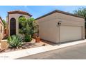 Charming single-level home with stucco exterior, a two-car garage and a decorative tiled front courtyard gate at 4313 N 29Th Way, Phoenix, AZ 85016