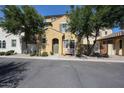 Charming two-story home with an inviting entryway and mature trees shading the front at 451 S Hawes Rd # 53, Mesa, AZ 85208