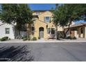 Charming two-story home with an inviting entryway and mature trees shading the front at 451 S Hawes Rd # 53, Mesa, AZ 85208