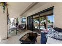 Inviting covered patio with comfortable seating, perfect for outdoor relaxation with views of the pool at 6249 E Camelot Dr, Mesa, AZ 85215