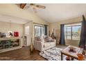 Bright living room with wood floors, large windows, comfortable sofa, ceiling fan, and neutral paint at 839 S Westwood -- # 287, Mesa, AZ 85210