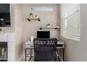 Bright desk area with shelving, perfect for a home office, near a window at 11375 E Sahuaro Dr # 2015, Scottsdale, AZ 85259