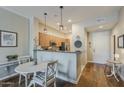 Charming dining area with seating for four, seamlessly flowing into the modern kitchen at 11640 N Tatum Blvd # 2013, Phoenix, AZ 85028