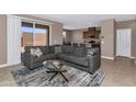 Spacious living room with a comfortable sectional sofa and access to the backyard at 1255 N Arizona Ave # 1251, Chandler, AZ 85225