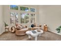 Bright sitting room with large windows and white shutters at 1365 N Drexel St, Mesa, AZ 85207