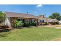 Charming single-story brick home with a well-manicured lawn and lush landscaping surrounding the property at 1407 E 1St St, Mesa, AZ 85203
