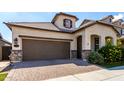 Stunning curb appeal with a paver driveway and lush landscaping at this stylish home at 2716 S Chatsworth --, Mesa, AZ 85209