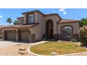 Two-story home with a well manicured front yard at 3089 E Indigo Bay Dr, Gilbert, AZ 85234
