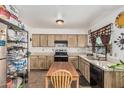 Functional kitchen featuring laminate countertops, oak cabinets, and essential appliances at 3208 W Wagoner Rd, Phoenix, AZ 85053